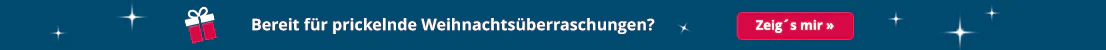 Der Werbebanner hat ein Hintergrund in der Farbe petrol. Grossflächig steht in weisser Schrift "Bereit für prickelnde Weihnachtsüberraschungen?" und zusätzlich eine Klickaufforderung mit dem Text "Zeig´s mir". Daneben ist ein Geschenk in der Farbe weiss und rot abgebildet.